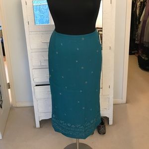 Emerald green skirt with tasteful side slit.